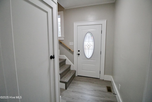 entryway with light hardwood / wood-style floors