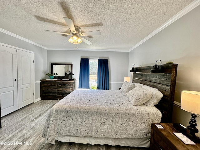 bedroom featuring crown molding, ceiling fan, wood-type flooring, and a textured ceiling