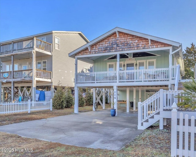 view of front of property with a carport and a porch