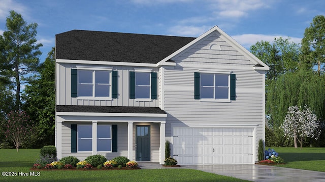 view of front of property with a garage and a front yard