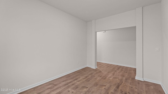 unfurnished bedroom with light wood-type flooring