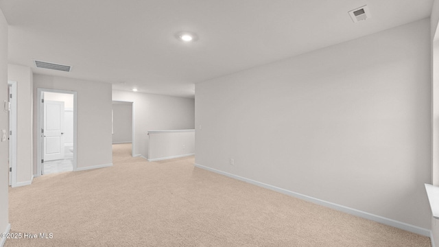 basement featuring light carpet