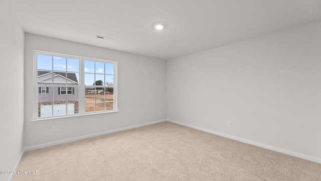 unfurnished room featuring carpet flooring