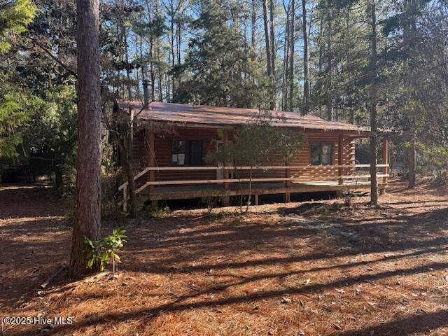 log cabin with a deck