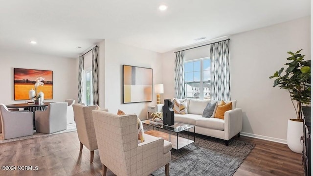 living room with dark hardwood / wood-style floors