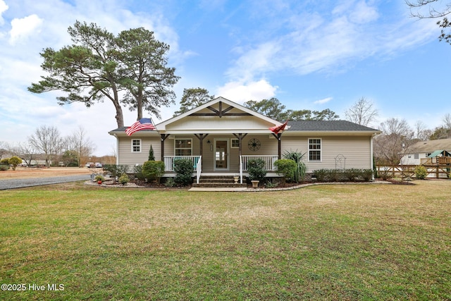 view of front of home with a porch and a front yard