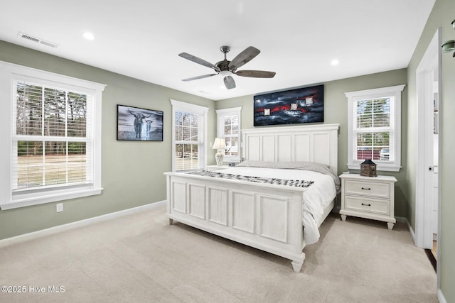 bedroom featuring ceiling fan and light colored carpet