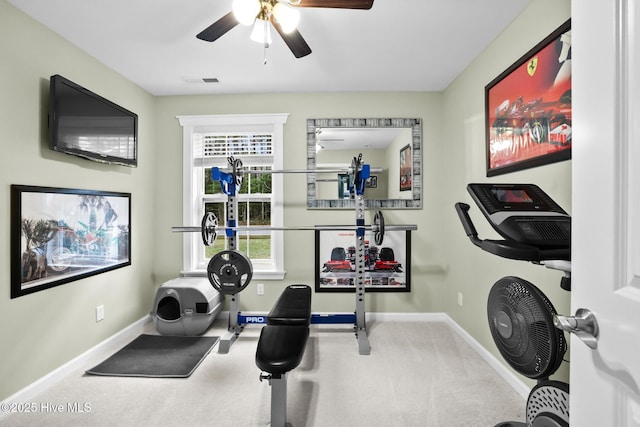 workout area with ceiling fan and carpet floors