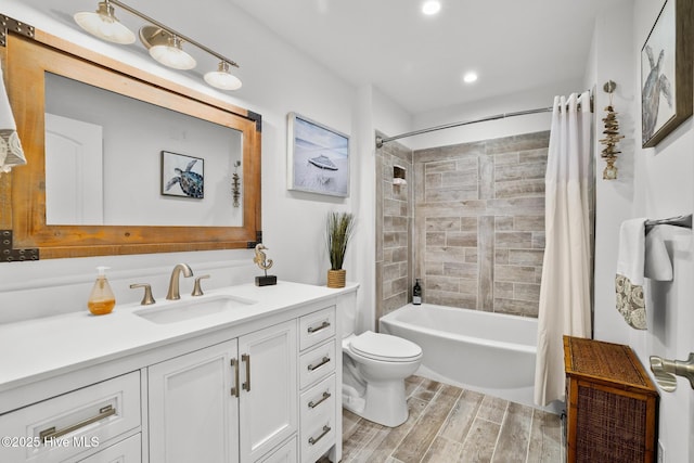 full bathroom with vanity, shower / bath combination with curtain, and toilet