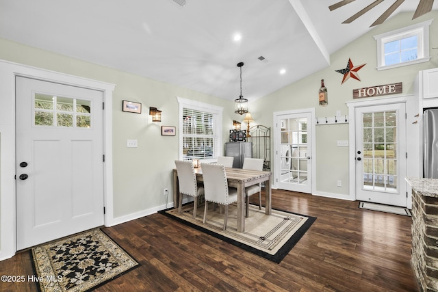 dining space with lofted ceiling, dark hardwood / wood-style flooring, and plenty of natural light