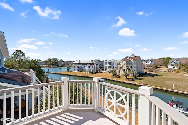 balcony with a water view and a residential view