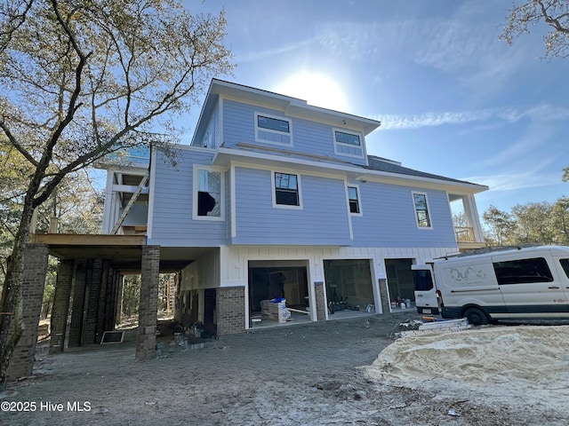 back of house with a garage