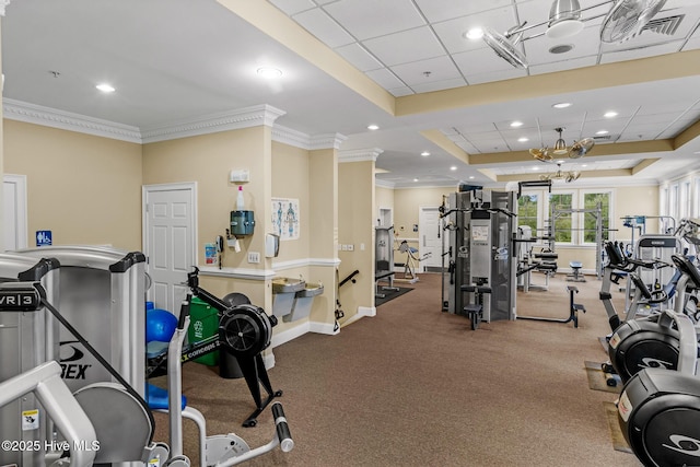 gym featuring crown molding, a paneled ceiling, and a tray ceiling