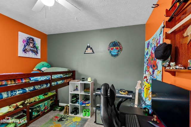 bedroom with ceiling fan, light colored carpet, and a textured ceiling