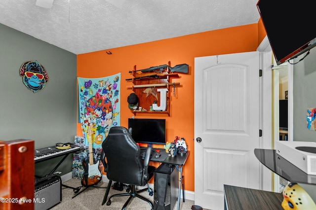 home office with light carpet and a textured ceiling