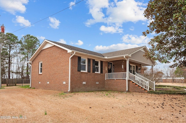 view of property exterior featuring covered porch