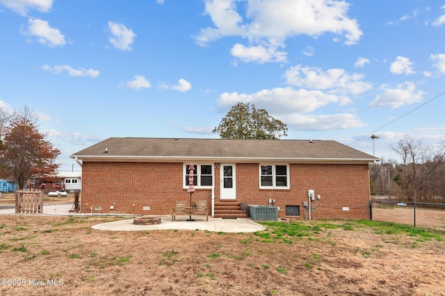 back of house featuring cooling unit, an outdoor fire pit, and a patio area