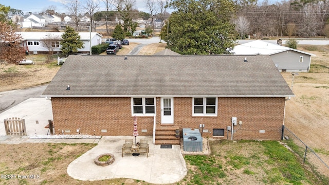 rear view of property with central AC and a patio area