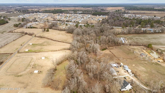 birds eye view of property featuring a rural view