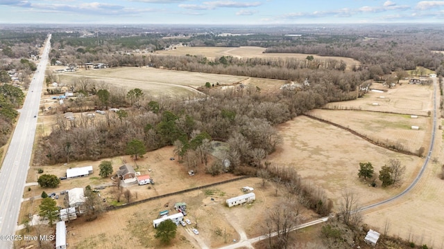 birds eye view of property with a rural view