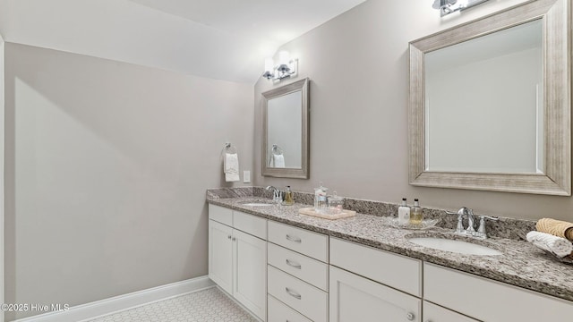 bathroom with tile patterned floors, vanity, and vaulted ceiling