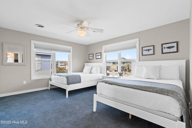 bedroom featuring carpet, visible vents, baseboards, and ceiling fan