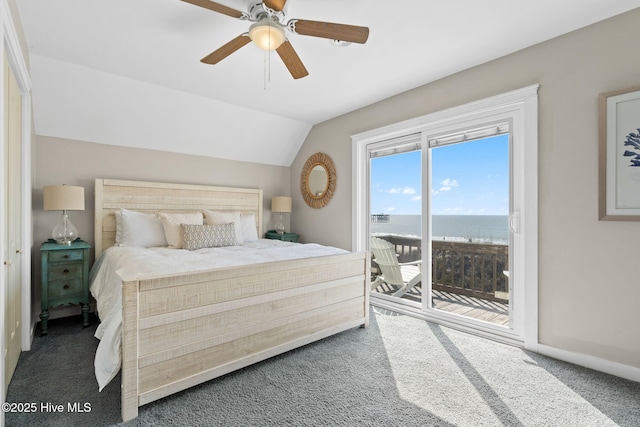 carpeted bedroom featuring vaulted ceiling, access to outside, a water view, and a ceiling fan