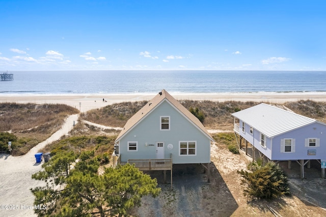 aerial view featuring a water view and a view of the beach