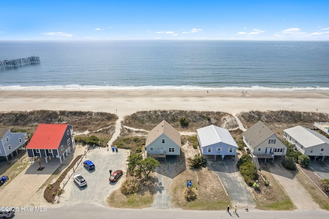 aerial view with a beach view, a water view, and a residential view