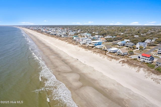 bird's eye view with a water view, a residential view, and a beach view