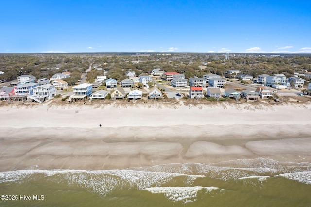 snowy aerial view with a residential view and a water view