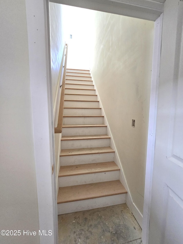 stairs with concrete floors