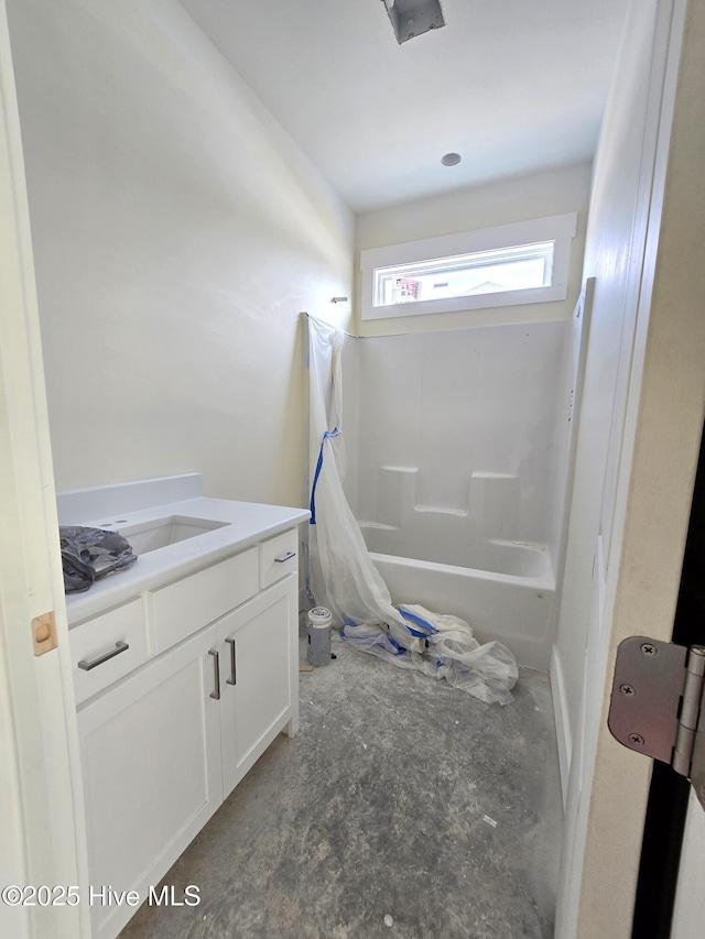 bathroom featuring shower / bath combination with curtain and vanity