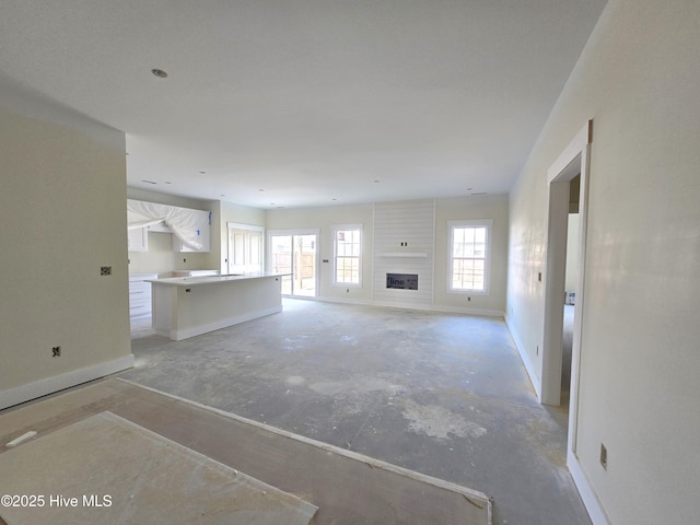 unfurnished living room featuring a fireplace