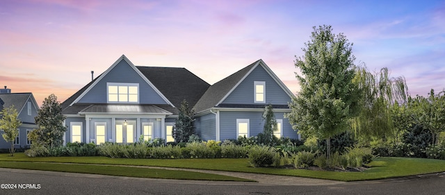 view of front of home with a yard