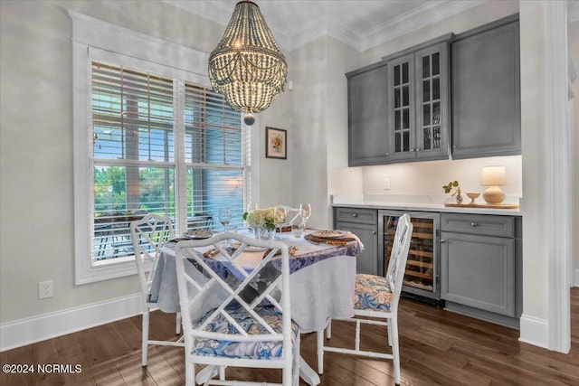 dining space with ornamental molding, wine cooler, dark wood-style flooring, and baseboards