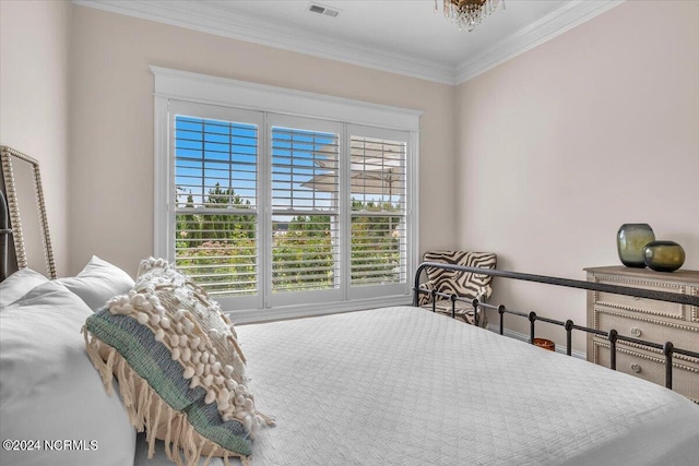 bedroom with visible vents and ornamental molding