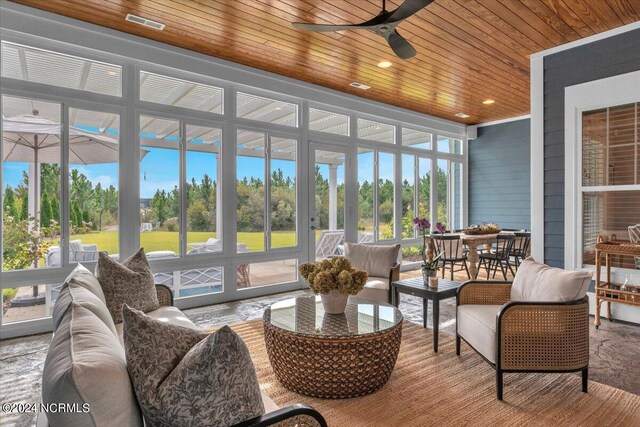 living room featuring ceiling fan, ornamental molding, dark wood-type flooring, and recessed lighting