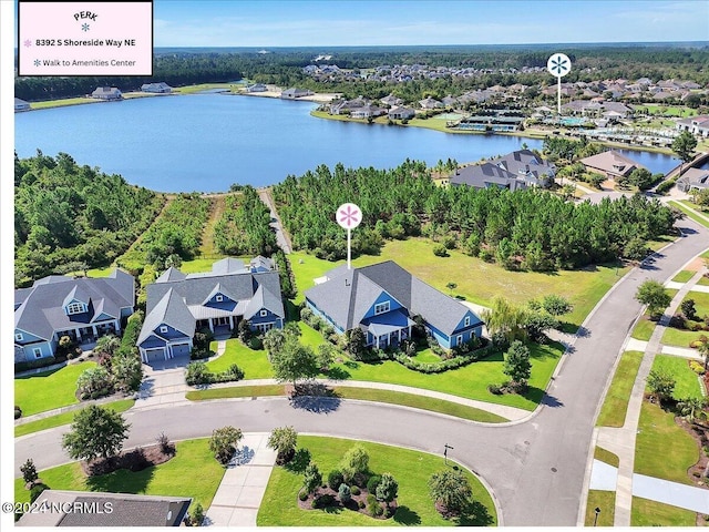 drone / aerial view with a water view and a residential view