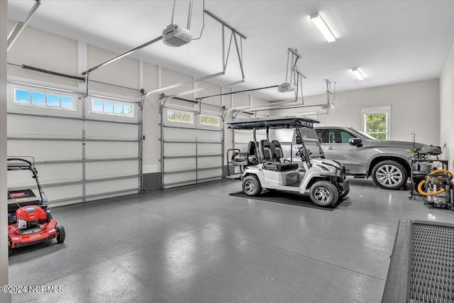 garage featuring a garage door opener