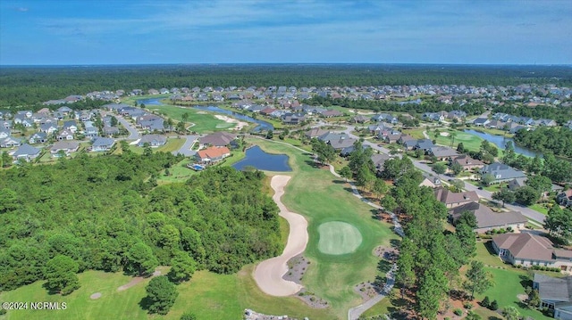 drone / aerial view with a water view and a residential view