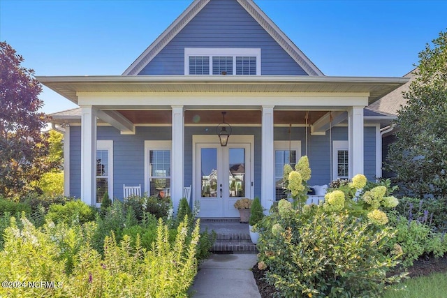 view of exterior entry with a porch