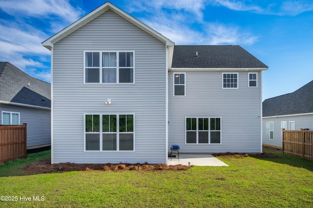 back of property featuring a patio area and a lawn