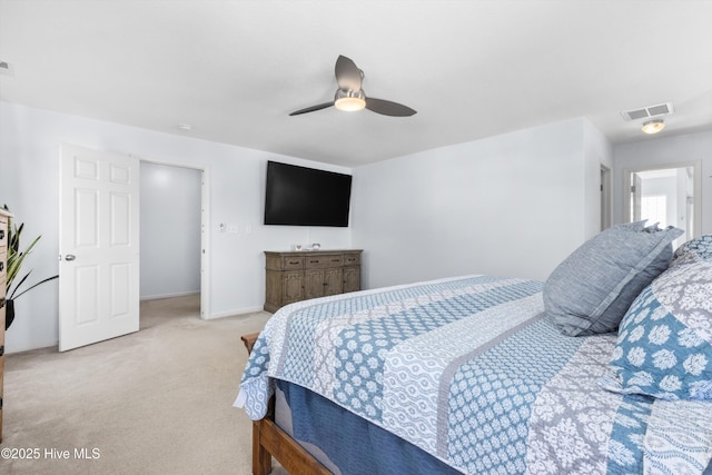 bedroom featuring light colored carpet and ceiling fan