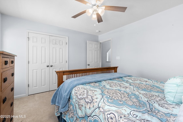 bedroom with light colored carpet, a closet, and ceiling fan