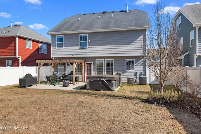 rear view of house with a patio area, central air condition unit, a hot tub, a yard, and a pergola