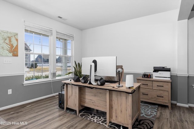 office space with dark wood-type flooring