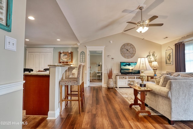 living room featuring recessed lighting, a ceiling fan, visible vents, vaulted ceiling, and dark wood finished floors