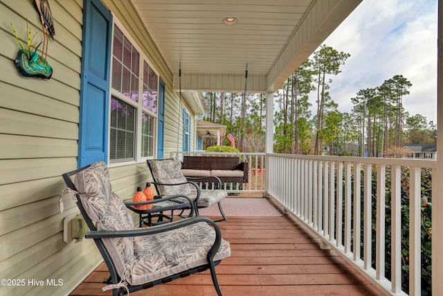 wooden terrace with a porch