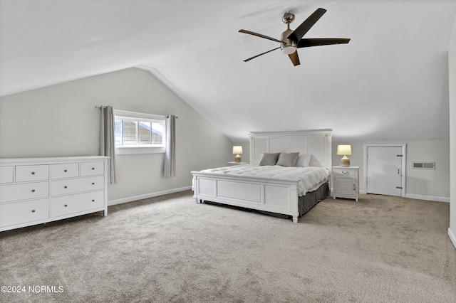 bedroom with vaulted ceiling, light carpet, and ceiling fan